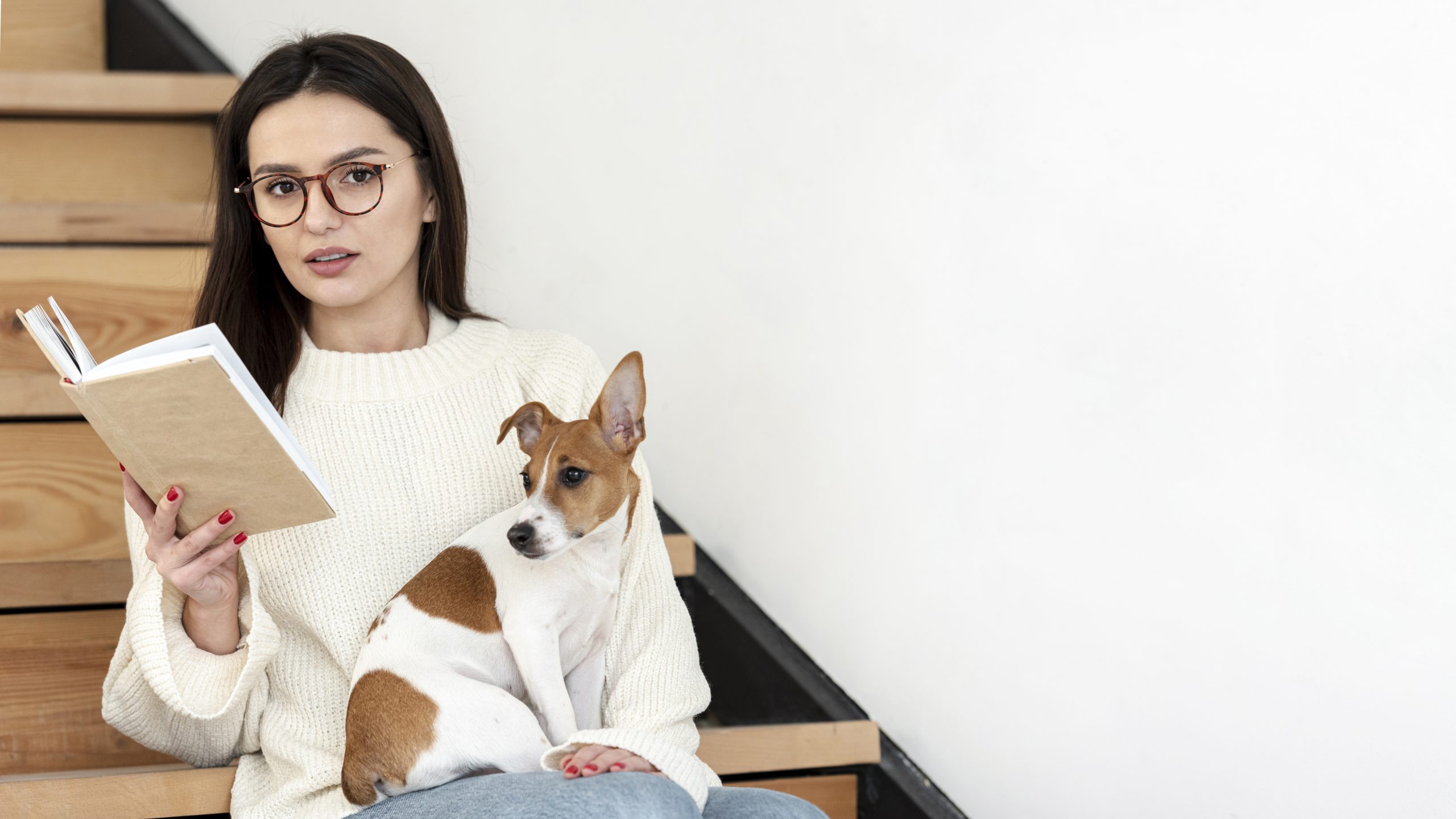woman-posing-stairs-with-book-her-dog
